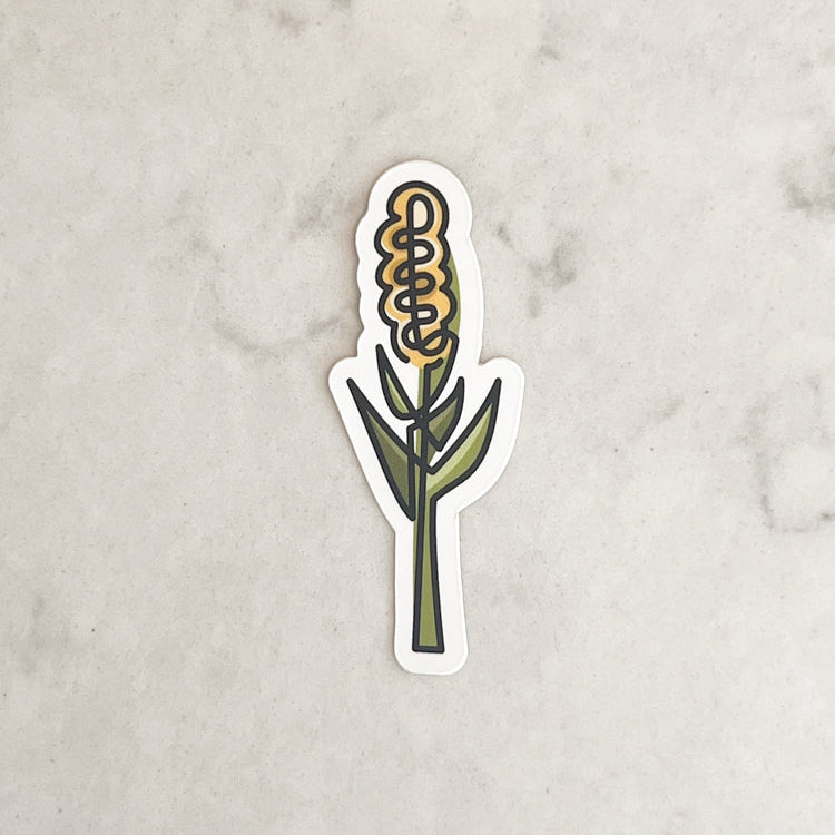 Sticker of a corn cob on a marble surface