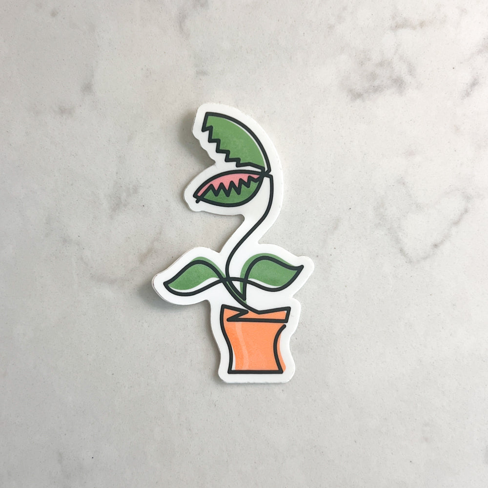 Sticker of a potted plant on a gray marble background