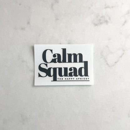 White card with 'Calm Squad' text on a marble surface