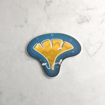 Stickers of yellow coral with fish on a marble surface